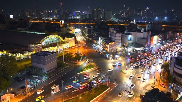 traffic at Hua Lamphong intersection and Hua Lamphong railway station at night in Bangkok, Thailand