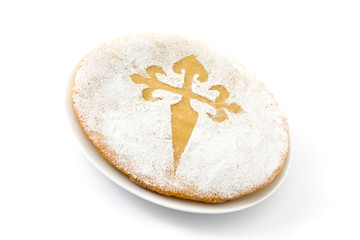 Tarta de Santiago. Traditional almond cake from Santiago in Spain, isolated on white background