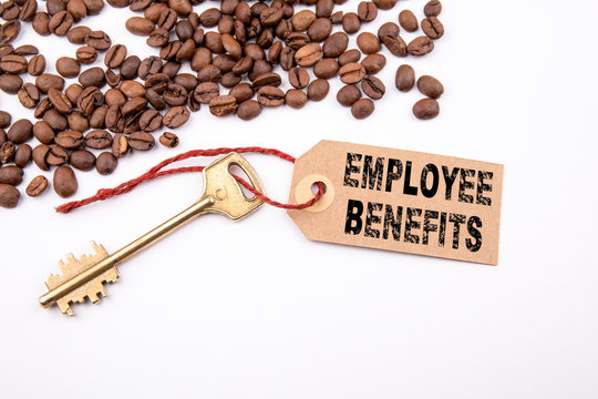 Employee Benefits concept. Key and a note on a white background