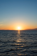 Seascape with beautiful sunset and sunset on the horizon.