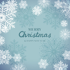 Fototapeta na wymiar White snowflakes on blue background. Merry Christmas Greetings card