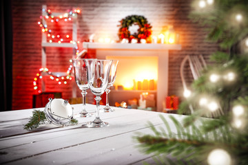 Table background with fireplace and christmas tree 
