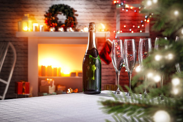 Table background with fireplace and christmas tree 