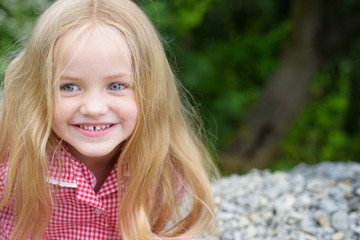 Naklejka premium Just feeling completely happy. Little girl wear long hair. Small girl with blond hair. Happy little child with adorable smile. Small child happy smiling. Let my hair down
