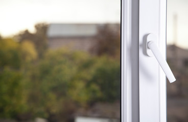Closed window with handle. PVC plastic