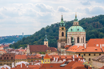 Fototapeta premium View over historic center of Prague, St. Nicholas Church, red roofs of Prague, Czech republic