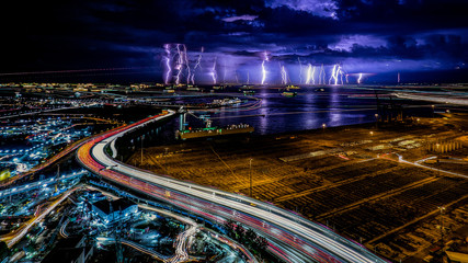 Beautiful Lightning and light trails in highway at Singapore