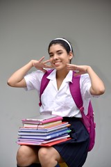 Cute Colombian Girl Student And Happiness Wearing School Uniform