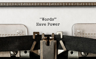 Text Words Have Power typed on retro typewriter