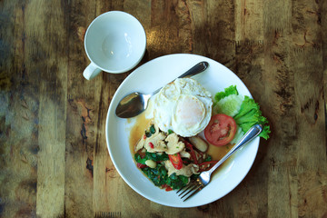 Fried Chicken with basil and fried egg