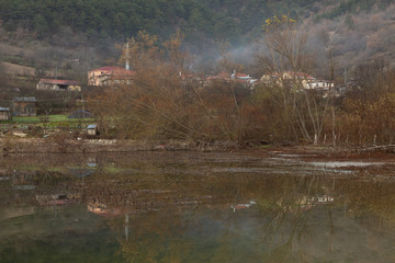 the village of Çubuklu reflected the calm waters of Çubuklu Lake in the Bolu mountains of Turkey