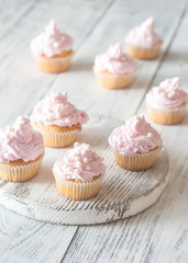 Obraz na płótnie Canvas Many pink cream homemade cupcakes