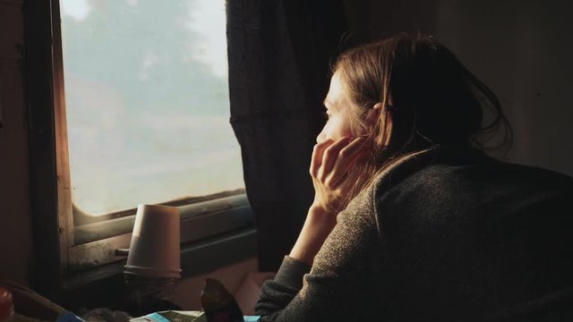Young women looking out of a asian train window