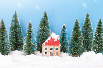 Obraz na płótnie Canvas Landscape forest with christmas trees and house on the snow in winter. Concept of christmas holiday celebration and new year