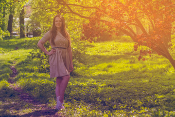 Beautiful girl in the summer park. Smiling