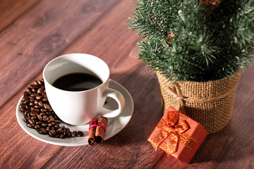 Coffee and other christmas symbol on the wooden table.