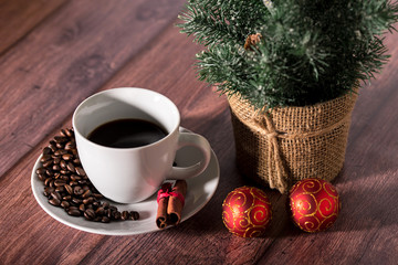 Coffee and other christmas symbol on a wooden table.