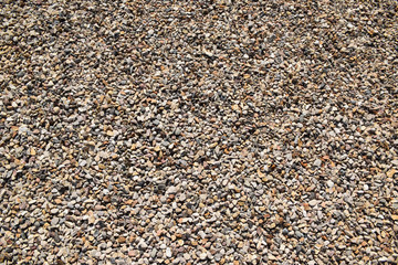 Small crushed stone on a walkway in a city park in Moscow. Moscow, Russia, September 2018.