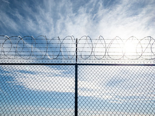 barbed wire fence - Powered by Adobe