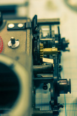 parts old retro film SLR camera on graph paper