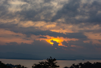 sunrise over Si Nakharin dam at Huay Mae khamin waterfall National Park ,Kanchana buri in Thailand.