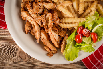 Greek gyros dis with fries and salad