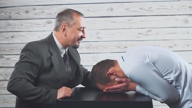 Angry mean caucasian boss shouting scolding frustrated incompetent employee for bad work or business failure.