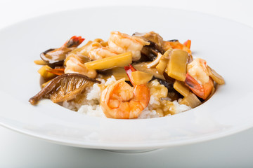 White plate of asian rise with seafood