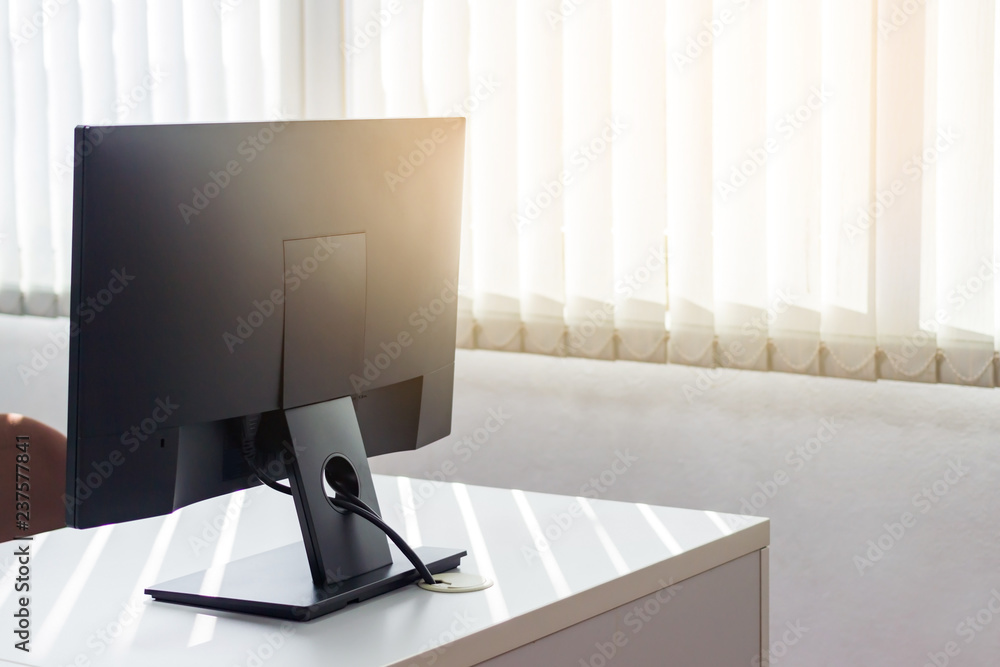 Poster back side of monitor on desktop with window sun light.image with copy space.