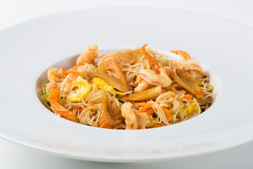 Plate of asian food with noodles and seafood