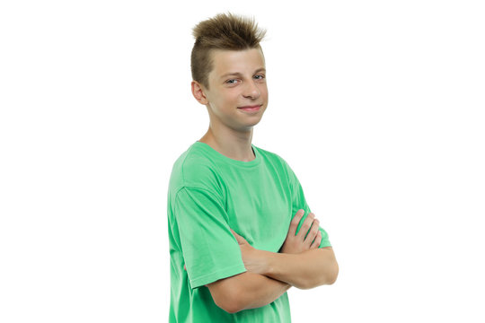 Portrait Of Happy Young Smiling Teenager Boy 14, 15 Years Old With Arms Crossed, White Background Isolated