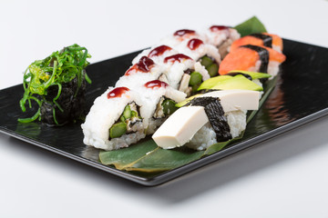 Set of uramaki and tamagoyaki sushi