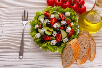 Greek salad on a wooden rustic background