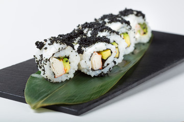 Uramaki sushi with black caviar