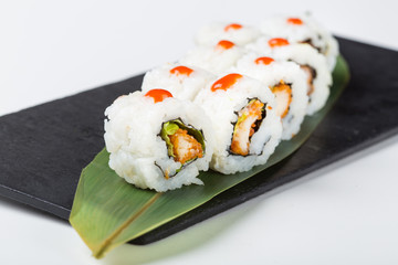 Fresh uramaki sushi with red sauce