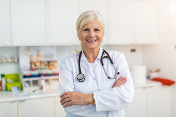 Senior female doctor smiling at the camera