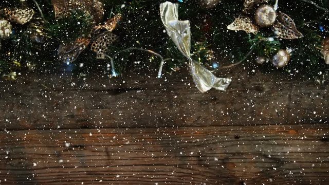 Video composition with snow over desk with Christmas decoration