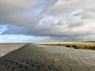 North Sea Shore in East Frisia (Ostfriesland) with Dramatic Clouds and Light