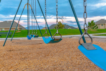 Swing with homes and mountain in the background