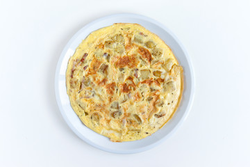 top view of italian frittata on white background, typical dish with eggs, potatoes and bacon