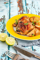 Roasted Chicken Thighs Served with Lemon Vertical Photo