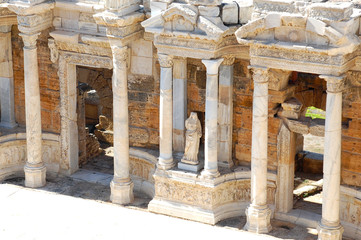 Columns and statues in the ancient amphitheater in Hierapolis, Pamukkale, Turkey. Photographed in the spring afternoon with good lighting.