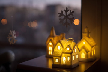 Fototapeta na wymiar three ceramic lamp houses. Christmas decoration