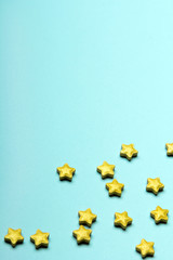 Christmas pastel background with golden stars, copy space for your text