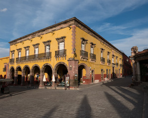 Fototapeta na wymiar Historic Yellow Building on the main Plaza in San Miguel de Allende, Mexico
