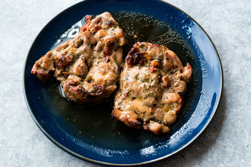 Juicy Chicken Thighs with Sauce of Thyme, Onion and Dried Tomatoes.