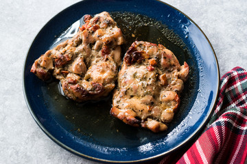 Juicy Chicken Thighs with Sauce of Thyme, Onion and Dried Tomatoes.