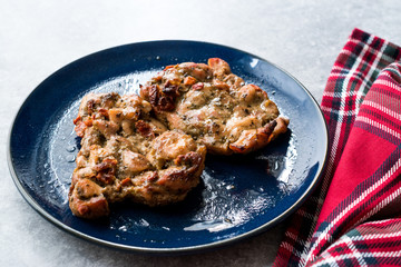 Juicy Chicken Thighs with Sauce of Thyme, Onion and Dried Tomatoes.