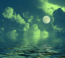 night lunar landscape full moon reflected in water night clouds