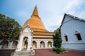 Wat Phra Pathom Chedi in blue sky, Thailand. Golden stupas.